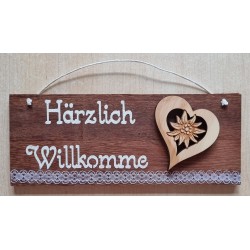 Schild rötlich " Härzlich...