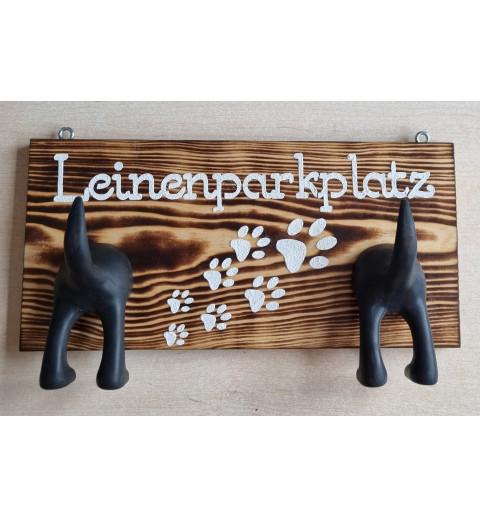 Leinenparkplatz geflammt mit zwei Hundehintern schwarz