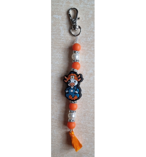 Schlüsselanhänger Kuh mit Mütze orange